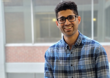 SES student Hammaad Adam smiles at camera