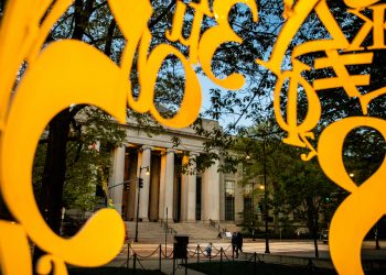 Looking through "Alchemist" sculpture toward MIT's main entrance